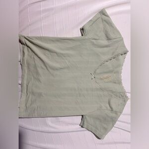 green tshirt with cute lace lining and a little bow